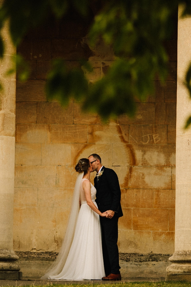 Couple holding hands and kissing