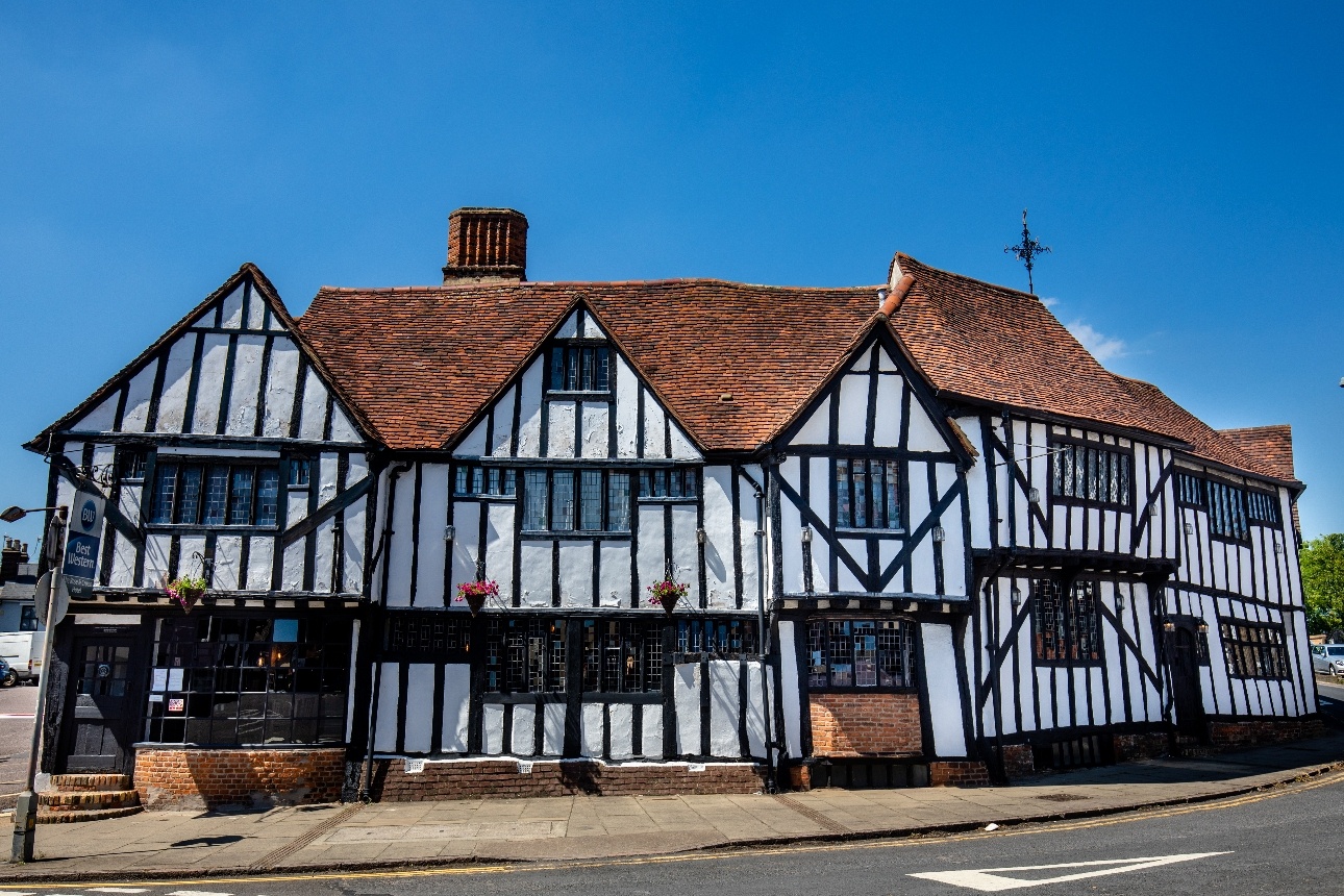 black and white pub facade on historic high street 