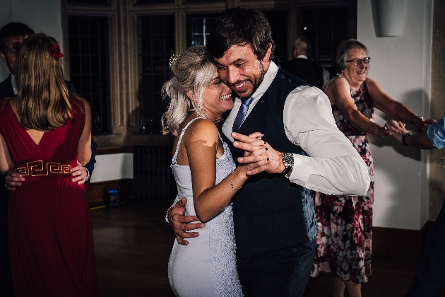 Bride and groom dancing together