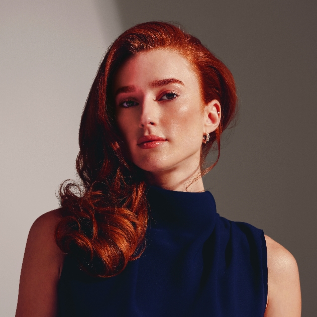 Woman with long wavy auburn hair