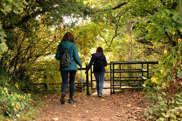 Two women walking in the woods