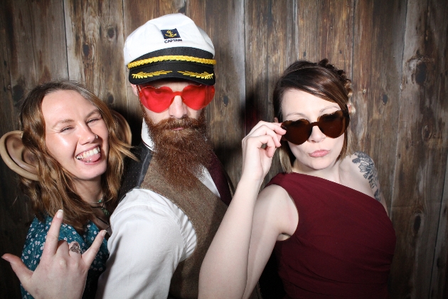 Group of wedding guests in photo booth