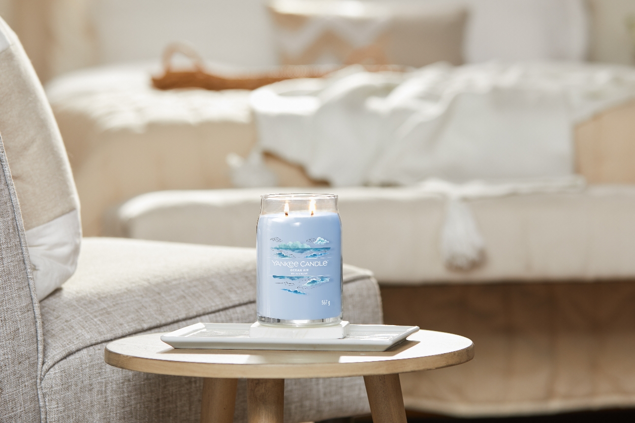 blue candle on a table in a living room