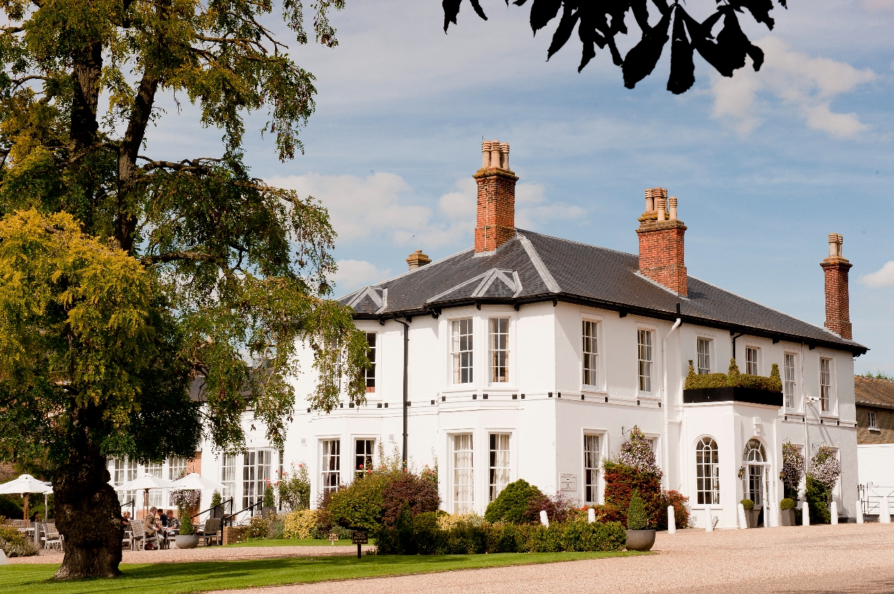 white georgian house with gravel drive