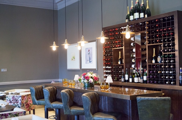 restaurant interior, wine rack wall, wooden bar