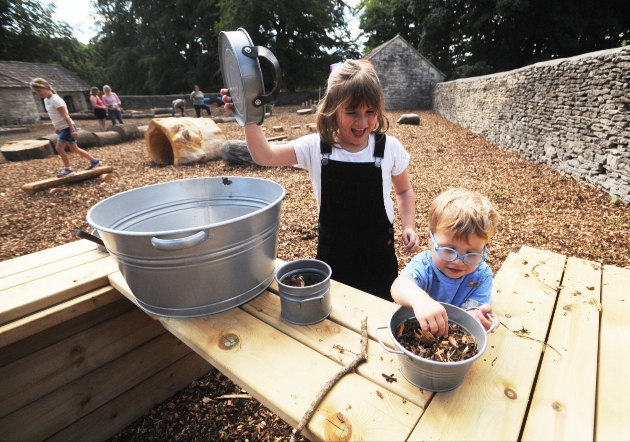 Children cooking in the revived outdoor play area at Old Lodge at Dyrham Park