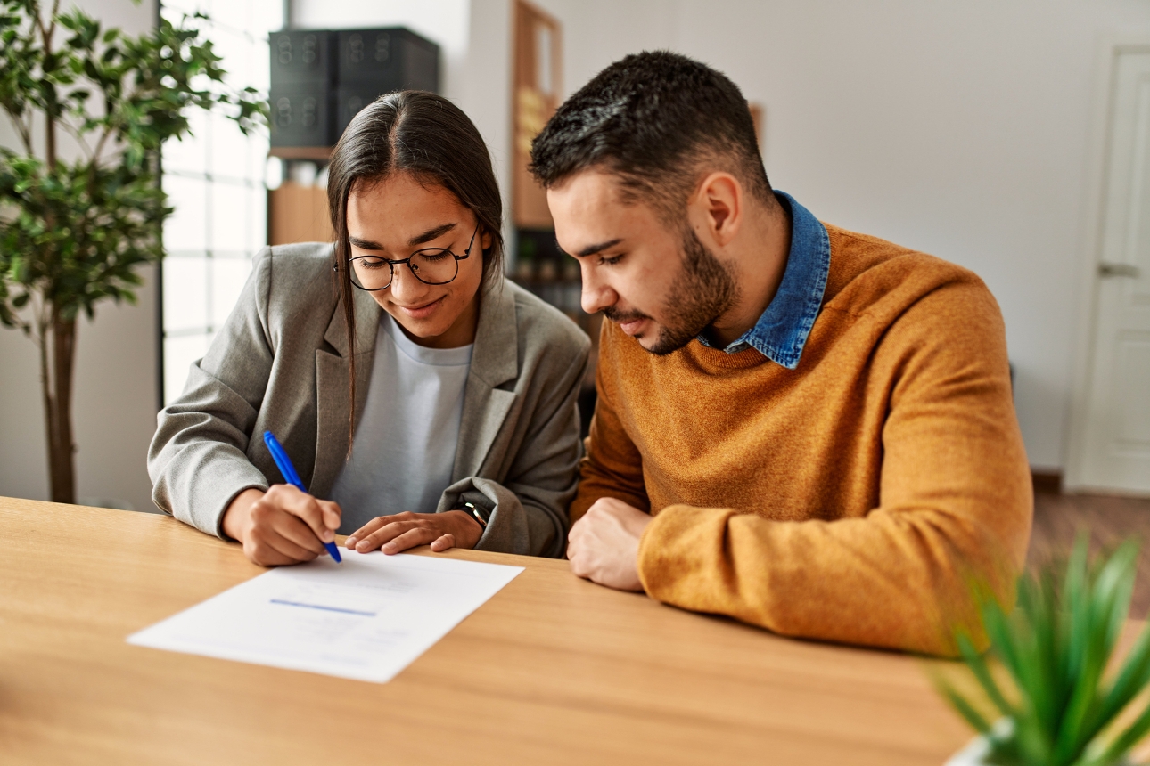 couple signing a document