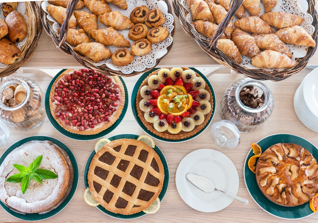 A table full of pasties and fruit