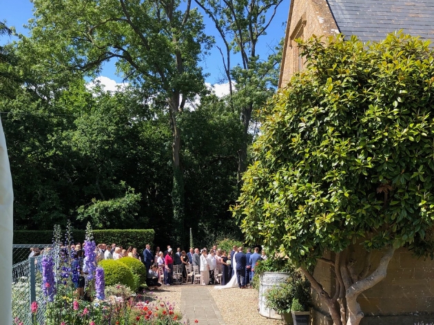 Outdoor ceremony at old bridge at the front of the house