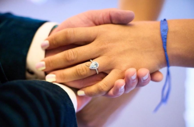 close up of wedding couple's hands handfasting